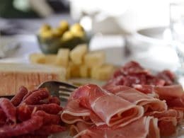 raw meat on white ceramic plate